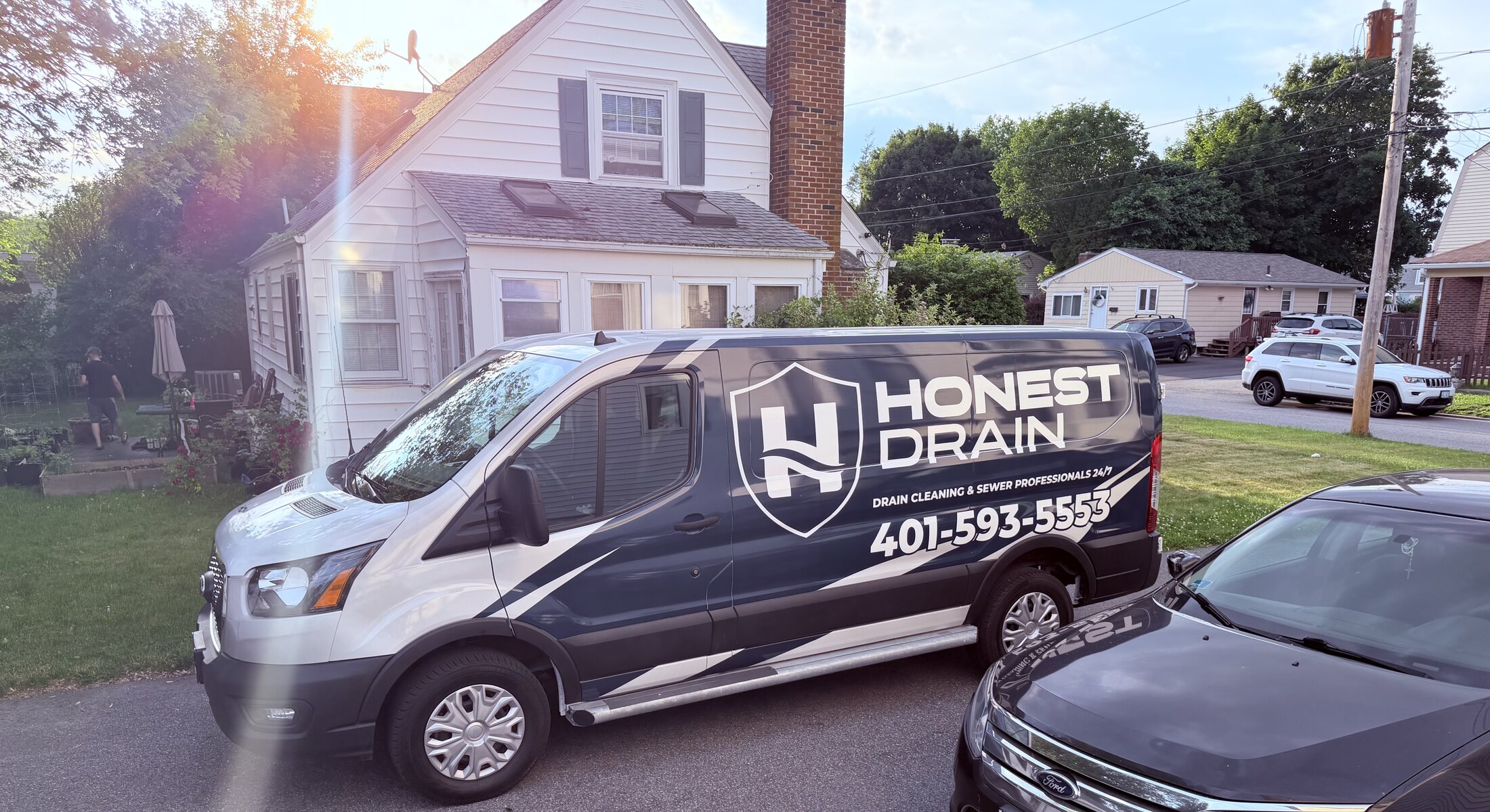 Honest Drain service van parked at a residential appointment